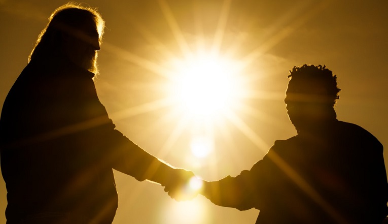 Teacher and student shaking hands